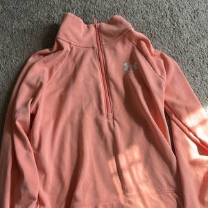 Pink women’s Under Armour half zip pullover. Size M.